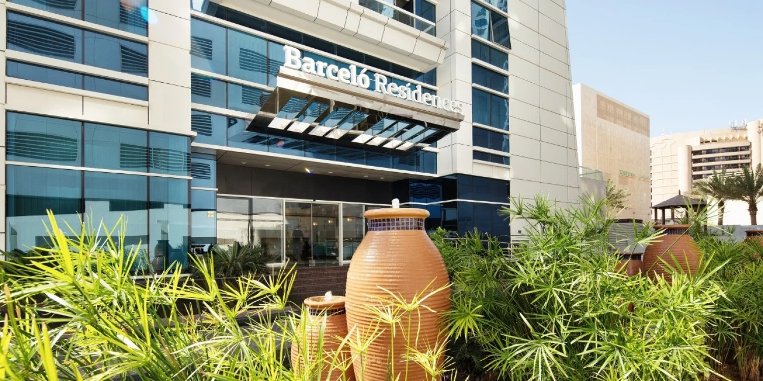a building with a large vase in front of it